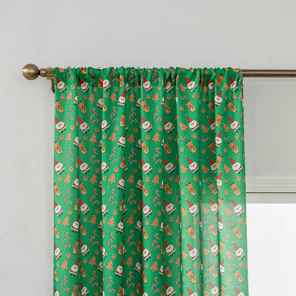 Green printed Christmas curtain with cartoon snowman and angel figures pattern