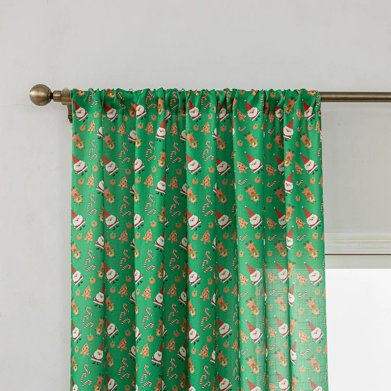 Green printed Christmas curtain with cartoon snowman and angel figures pattern