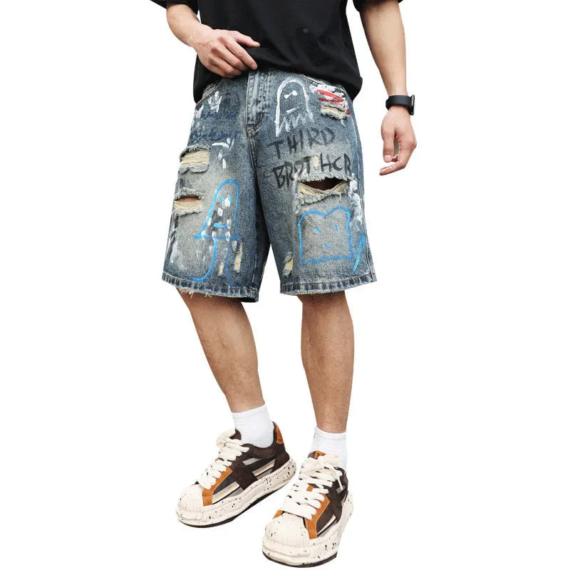 Blue ripped men's denim shorts with graffiti print and a zipper fly