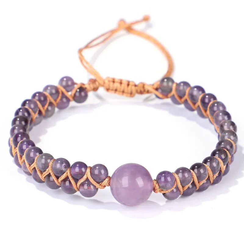 Handmade woven bracelet with geometric pattern in blue tigereye stone beads and pull closure.