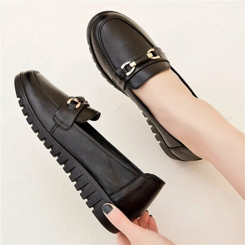 Black microfiber casual pumps with a round toe and low flat heel