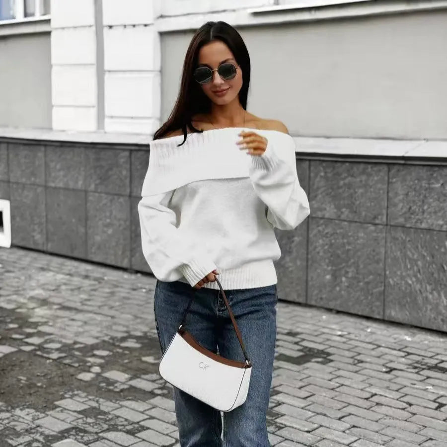 Grey off-the-shoulder sweater with a 3D pattern and strapless design, laid flat.