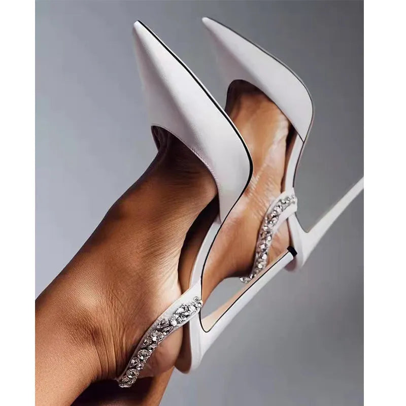 Women's black patent leather pointed toe high heel sandals with rhinestone details on the sides