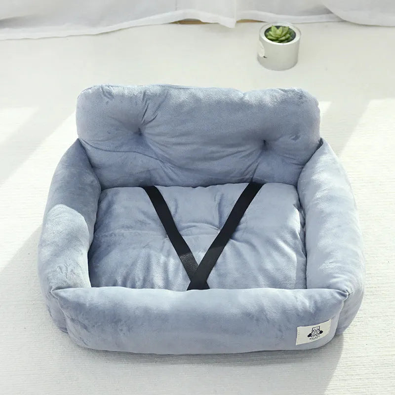 Grey and blue plaid cloth dog travel nest for use in a car, shown in two size options.
