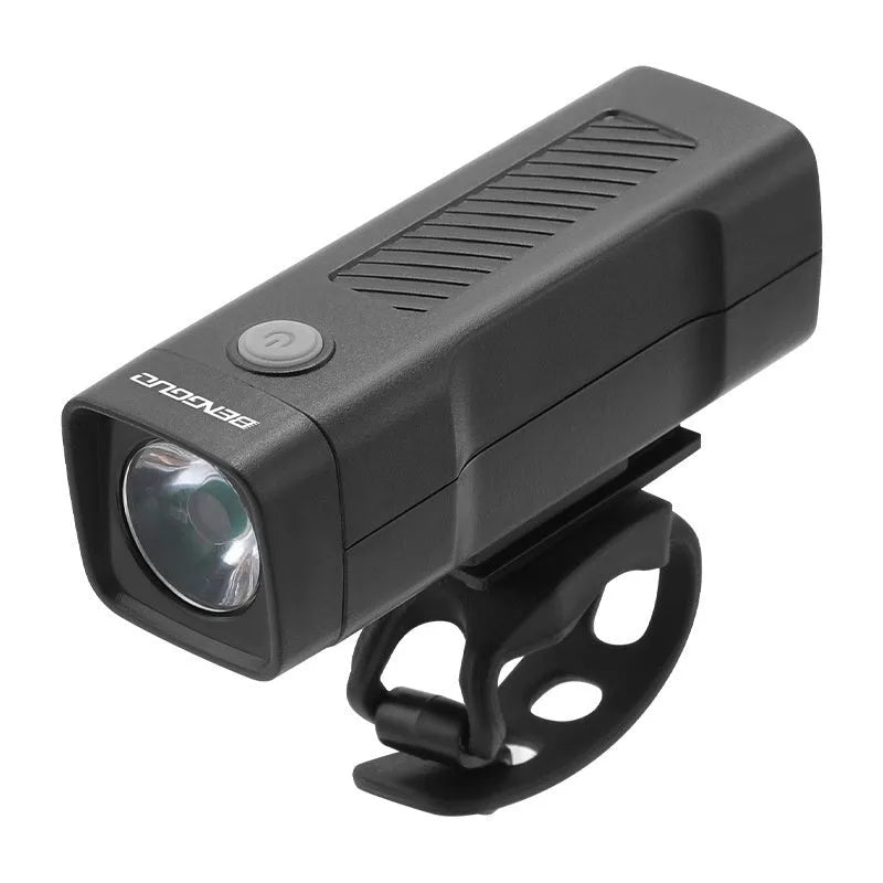 A black USB-rechargeable bicycle headlight mounted on a handlebar with a quick-release strap.