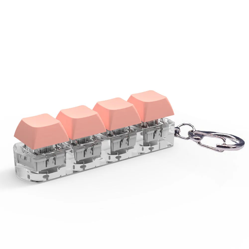 4-key mechanical keyboard switch tester with transparent bottom shell on desk