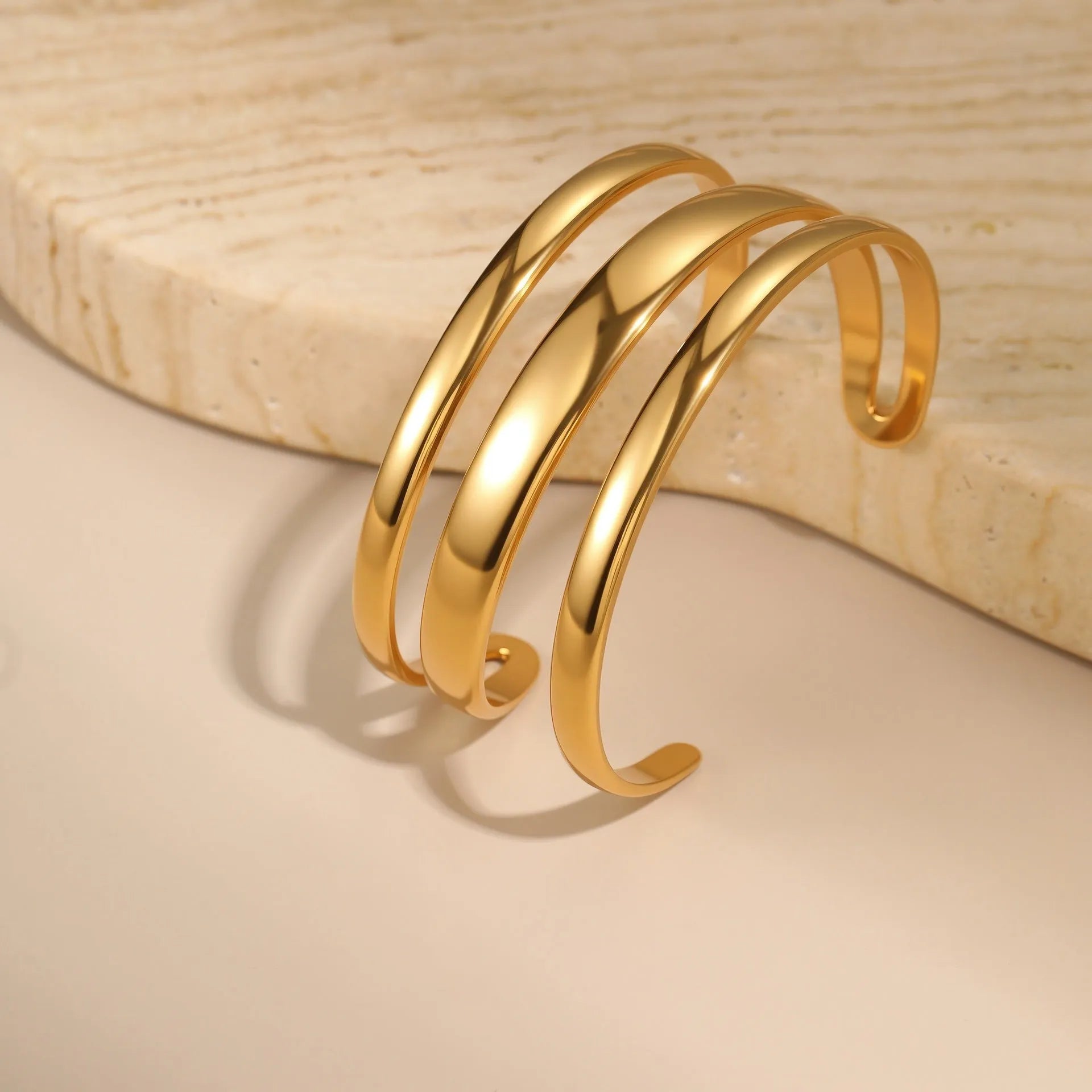 Stainless steel geometric line bracelet for women with simple opening clasp in gold or steel colour
