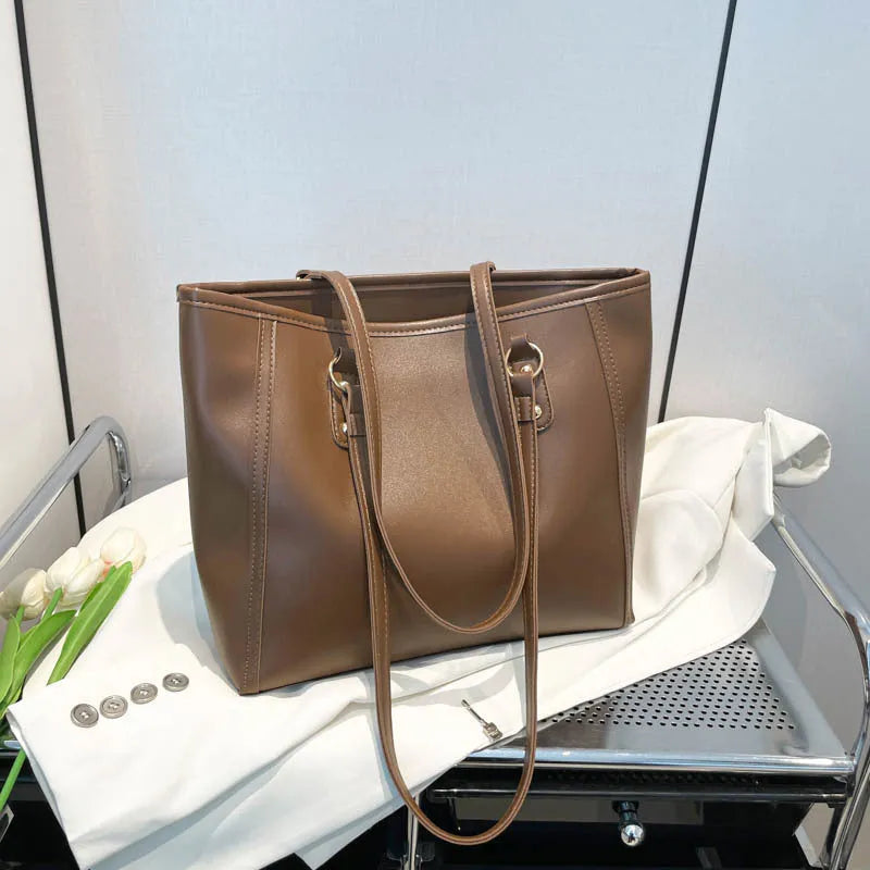 PU leather tote bag with contrast colour trim and internal mobile phone and document compartments