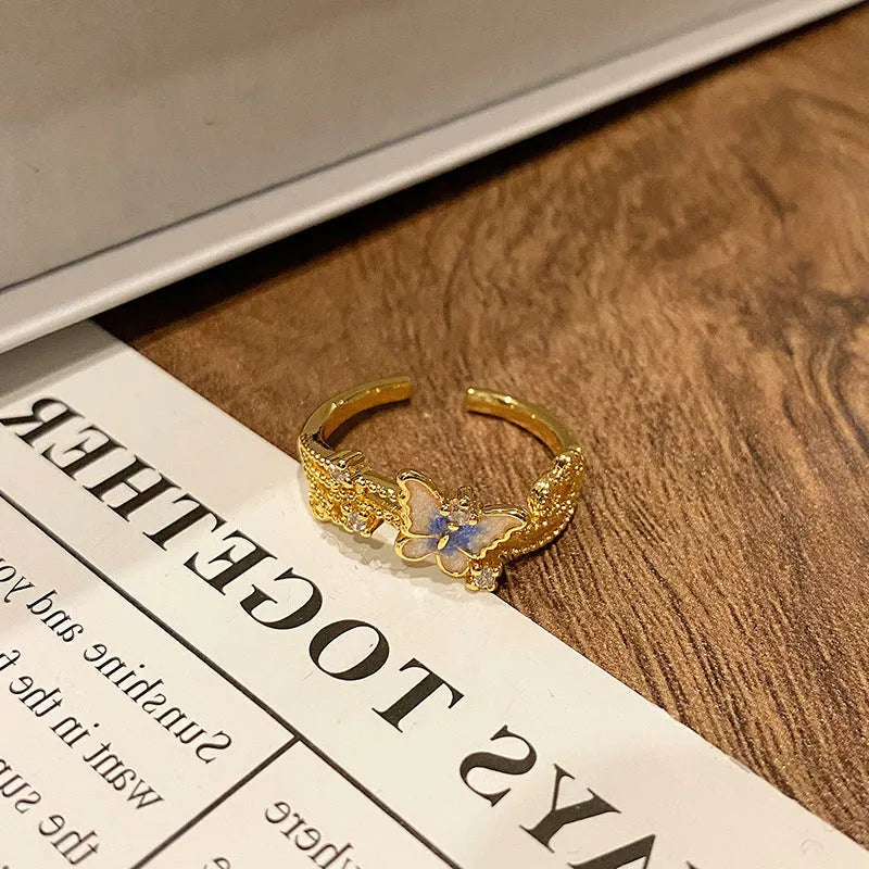 Copper women's ring featuring a creative Chinese butterfly design, available in multiple colours.