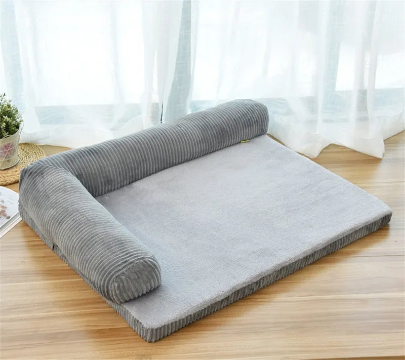 Corduroy fabric pet sofa dog bed in a grey colour, showing raised sides and plush high-density sponge padding.