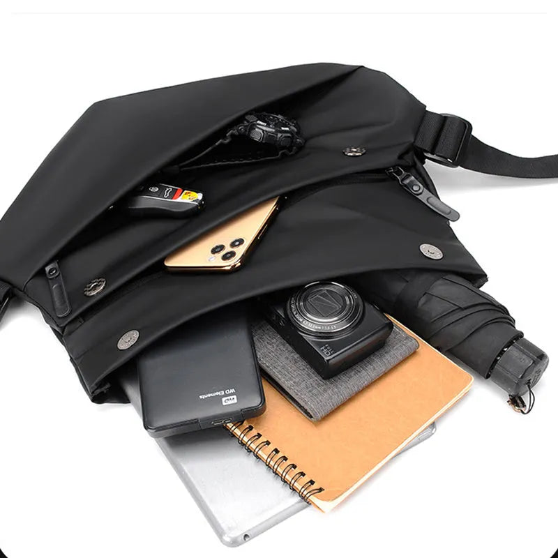 Grey medium square crossbody bag for men showing internal phone and document compartments