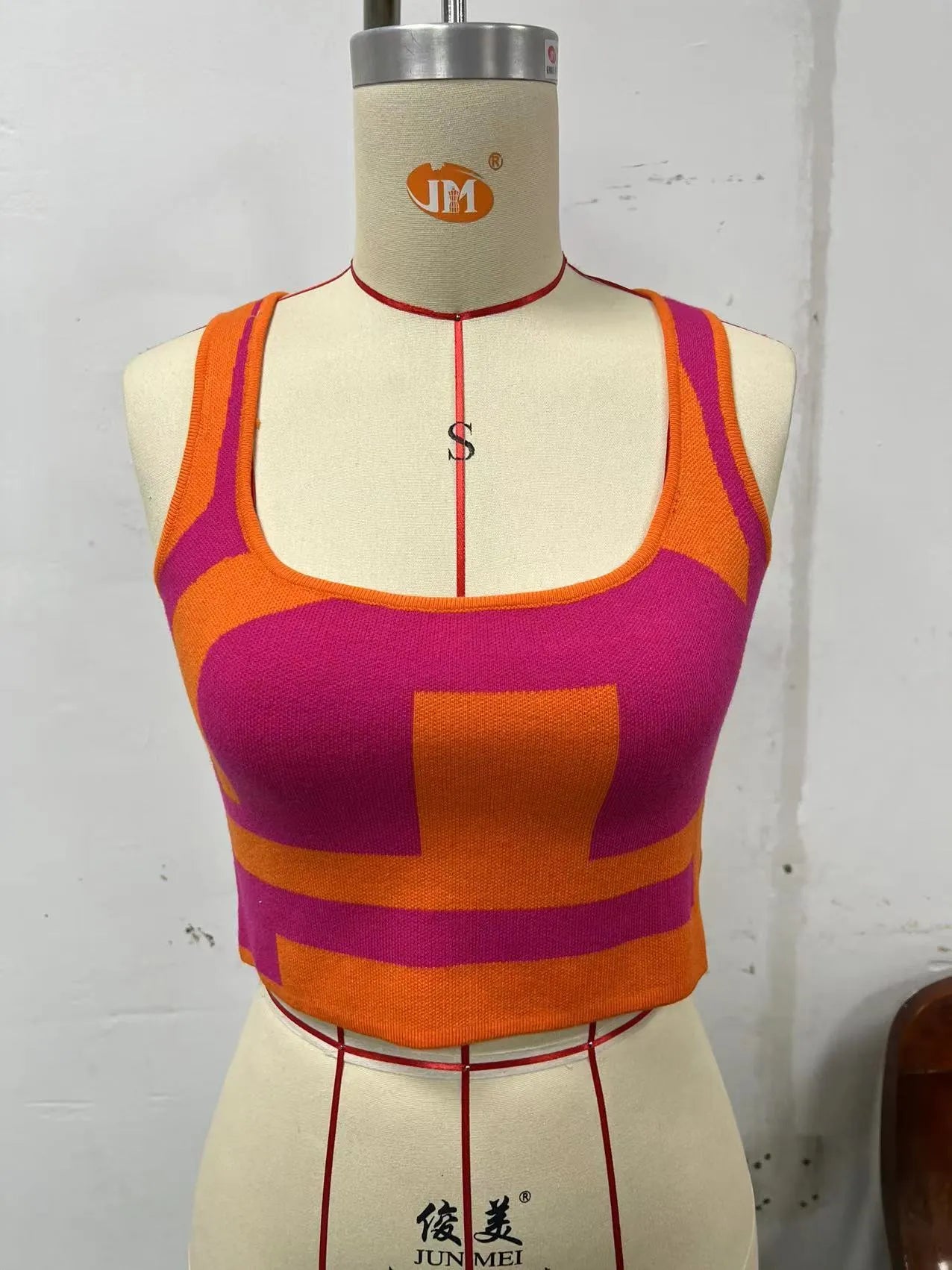 Women's slim fit U-neck camisole top in core-spun polyester fabric, shown in one of five colour options.