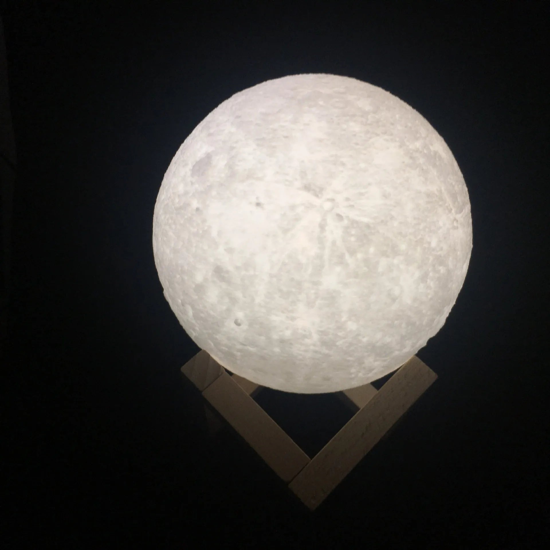 3D printed white moon lamp on wooden stand with touch metal ring at base