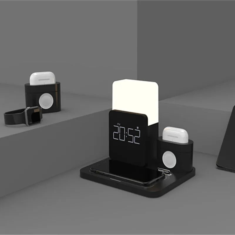 A dark green 3-in-1 Qi wireless charging stand on a desk, showing its foldable design and charging pad.
