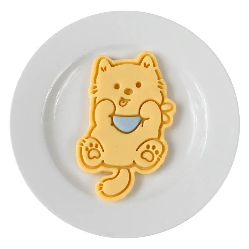 3D plastic biscuit mould with cartoon dog shapes including puppy head and birthday hat