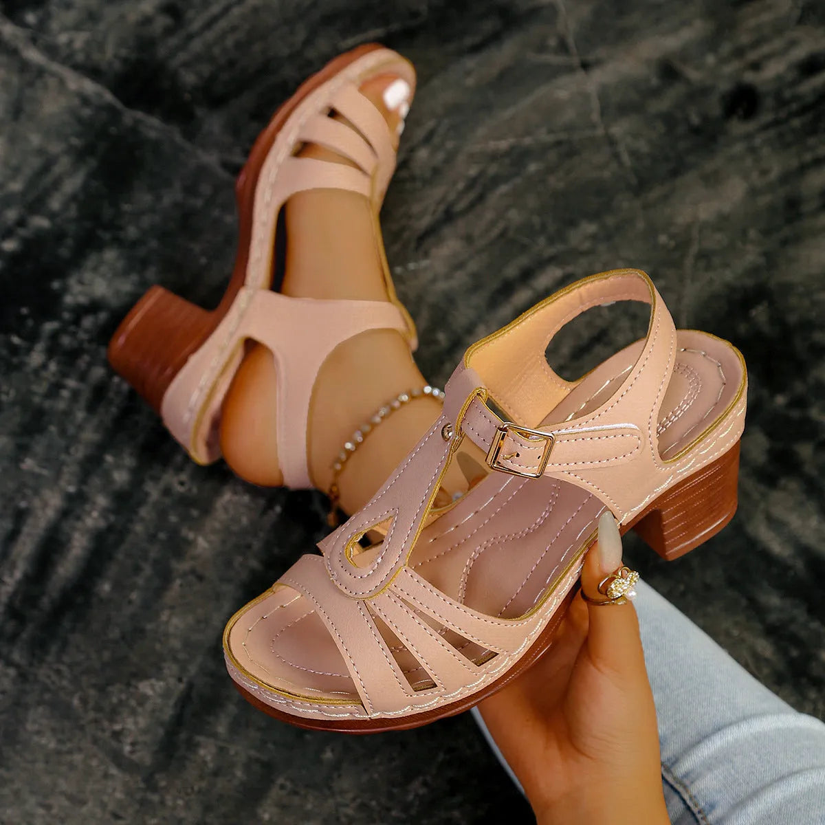 Women's black PU peep toe wedge sandals with a buckle strap on a light background