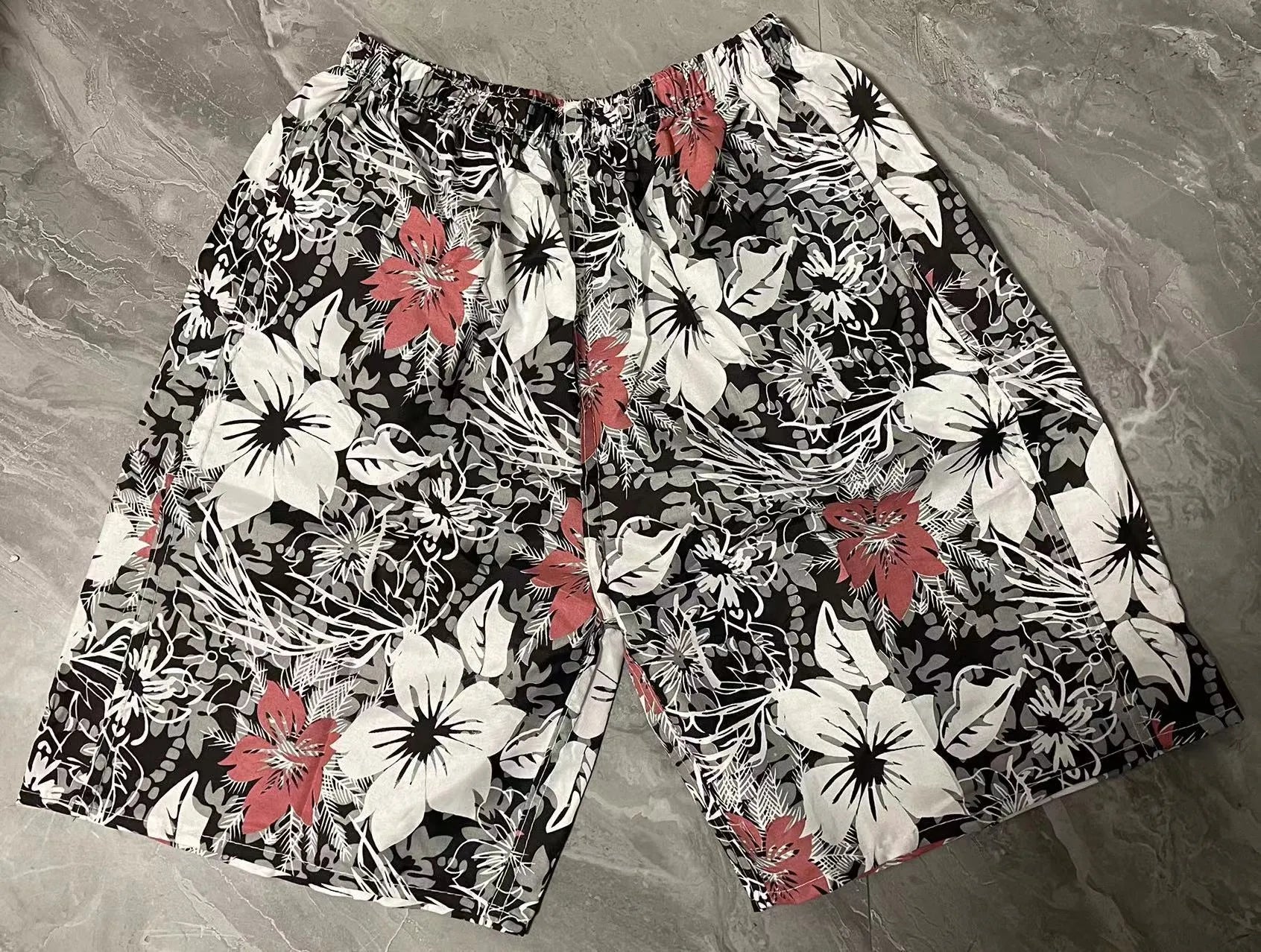 Men's floral print swimming trunks in multiple colour patterns with five-point design