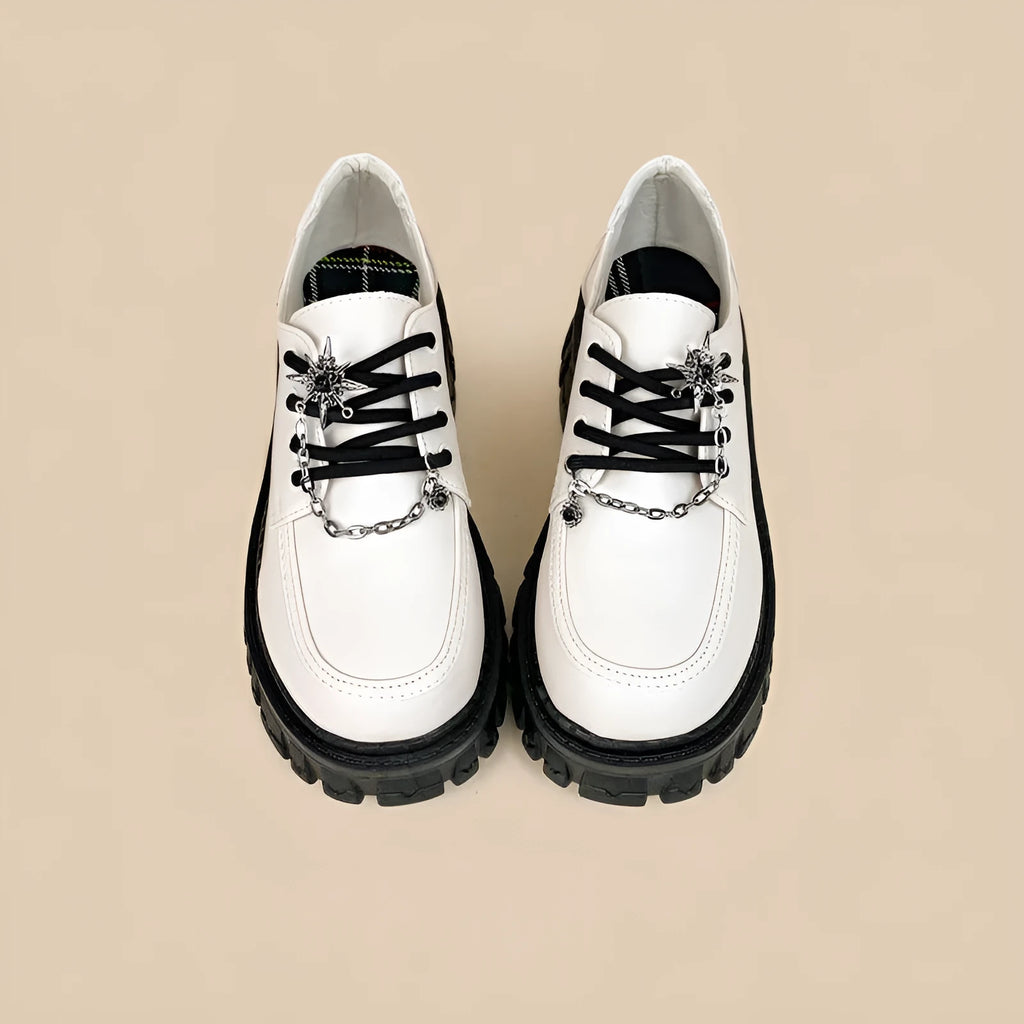 Women's Duke Asterism coloured loafers with a metal cross shoulder strap and round toe.