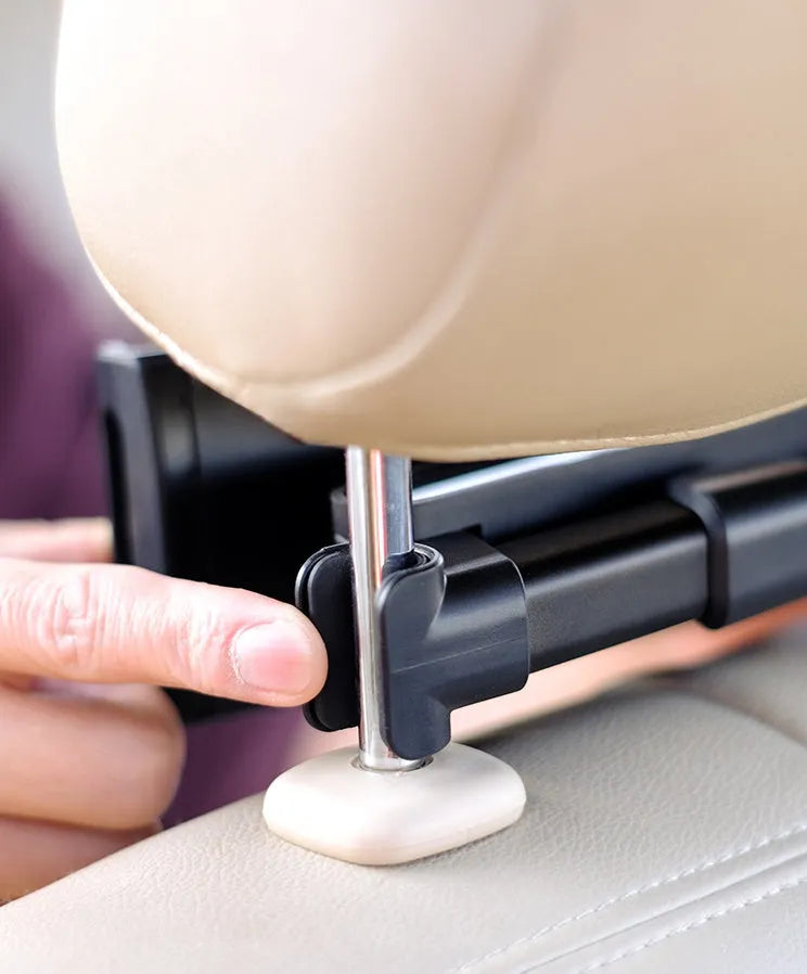 Black car headrest-mounted phone and tablet holder with universal snap-in silicone cradle.