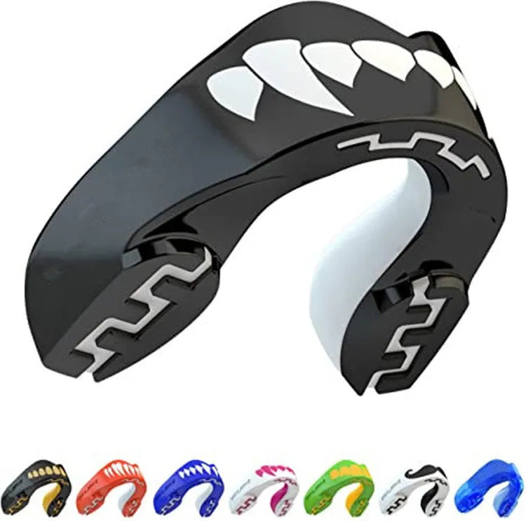 Adult boxing mouthguard with printed teeth design in black and white, for martial arts protection.