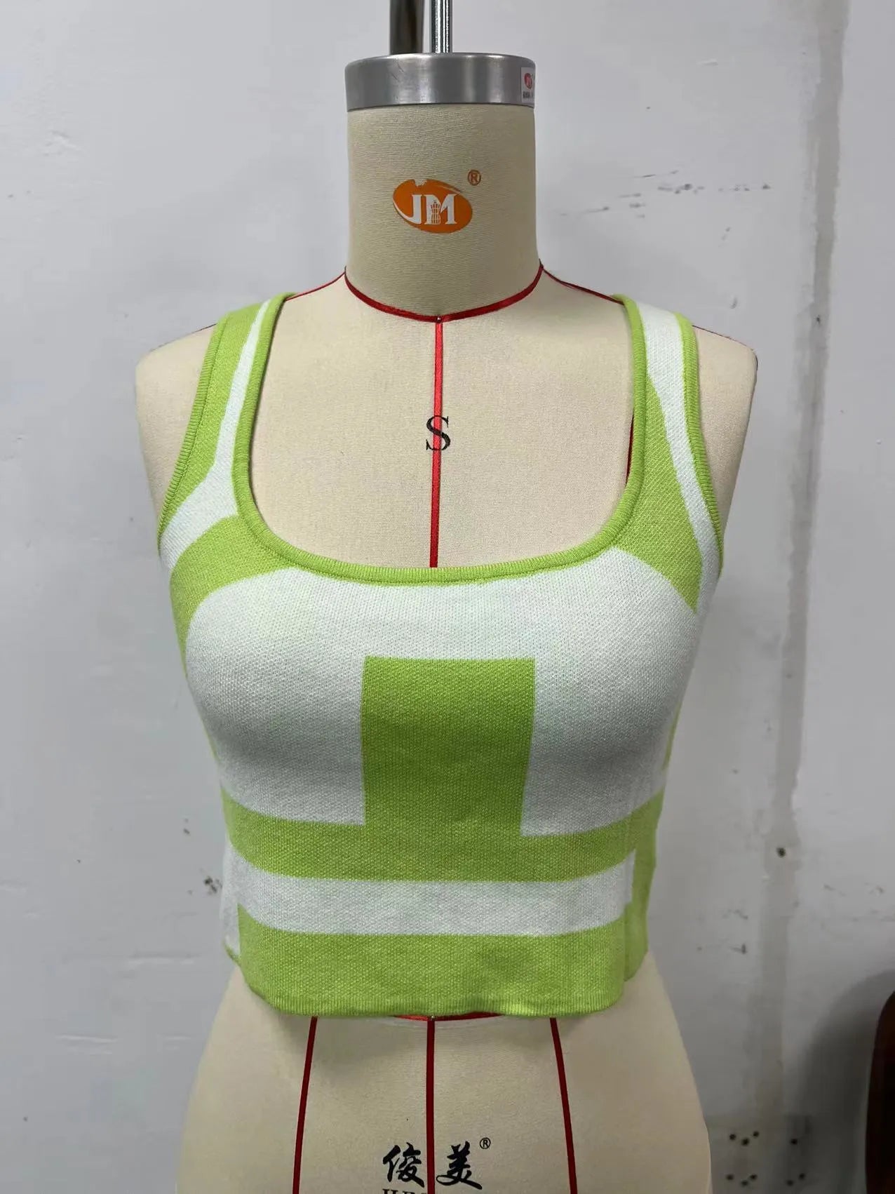Women's slim fit U-neck camisole top in core-spun polyester fabric, shown in one of five colour options.