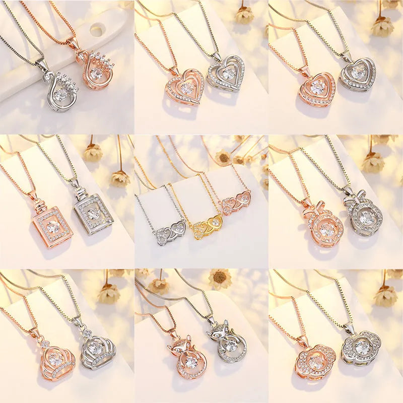 Heart-shaped sterling silver necklace with crown and bow charms on model