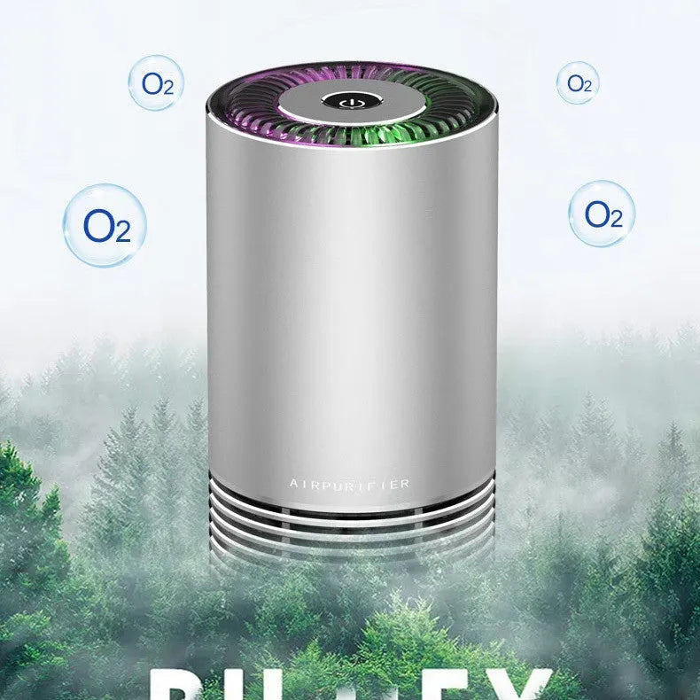 Compact cylindrical car air purifier in metallic grey with aluminium alloy casing.