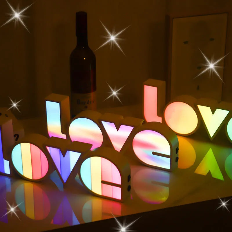 Rainbow style LED LOVE light decoration with plastic shell measuring 35.5cm by 13.5cm