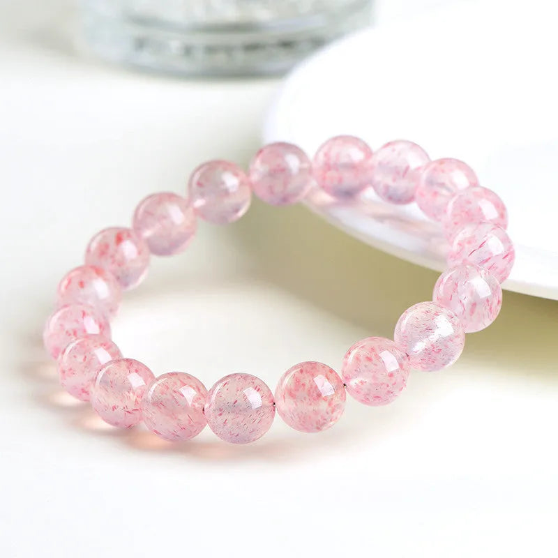 Natural white water strawberry quartz crystal ball bracelet with 10mm geometric beads.