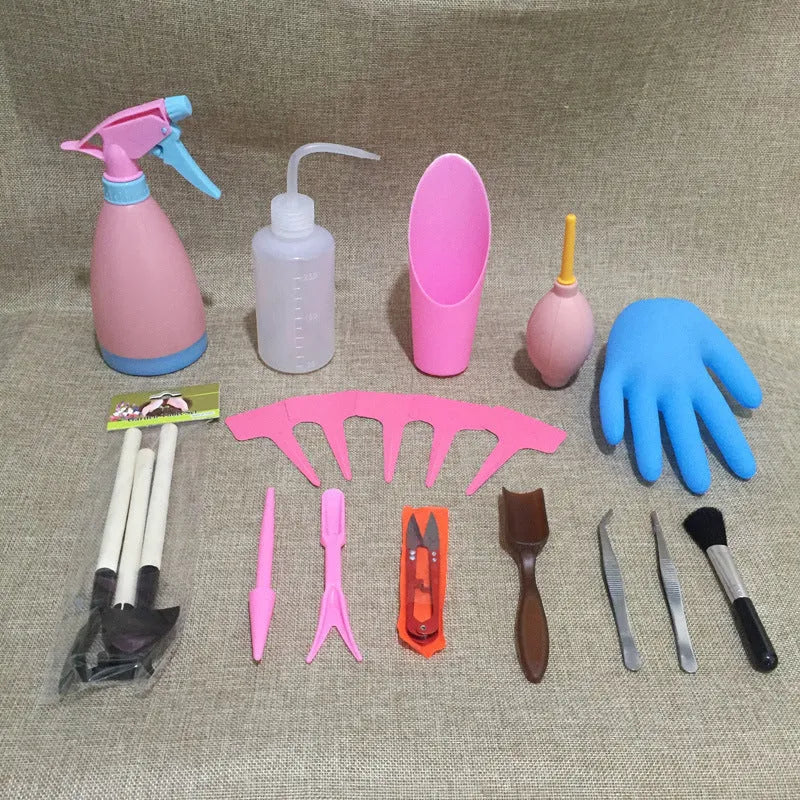 14-piece plastic succulent gardening tool set showing drip kettle, mini shovels, tweezers, and brush on a table.