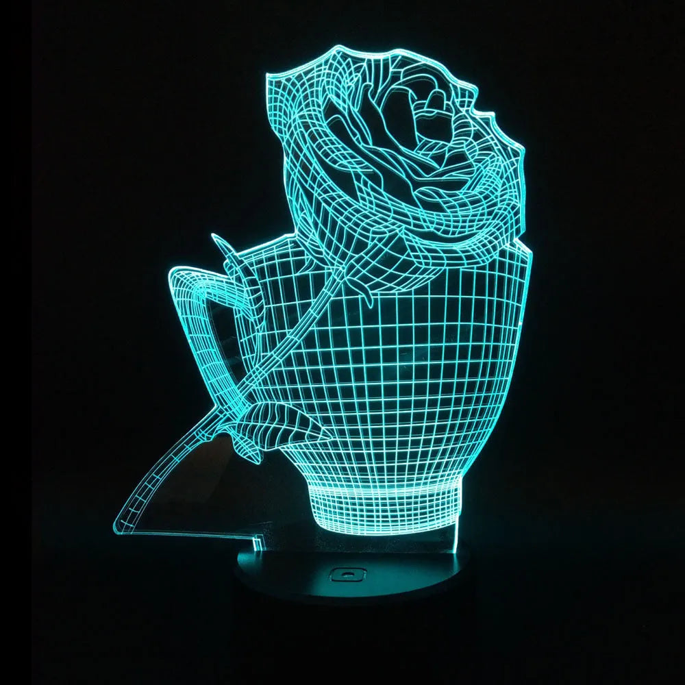 3D rose design acrylic night light with ABS base on a table, showing multi-coloured LED illumination.