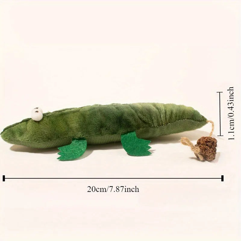 Green plush alligator cat toy with plant-based materials and peppermint scent for oral cleansing