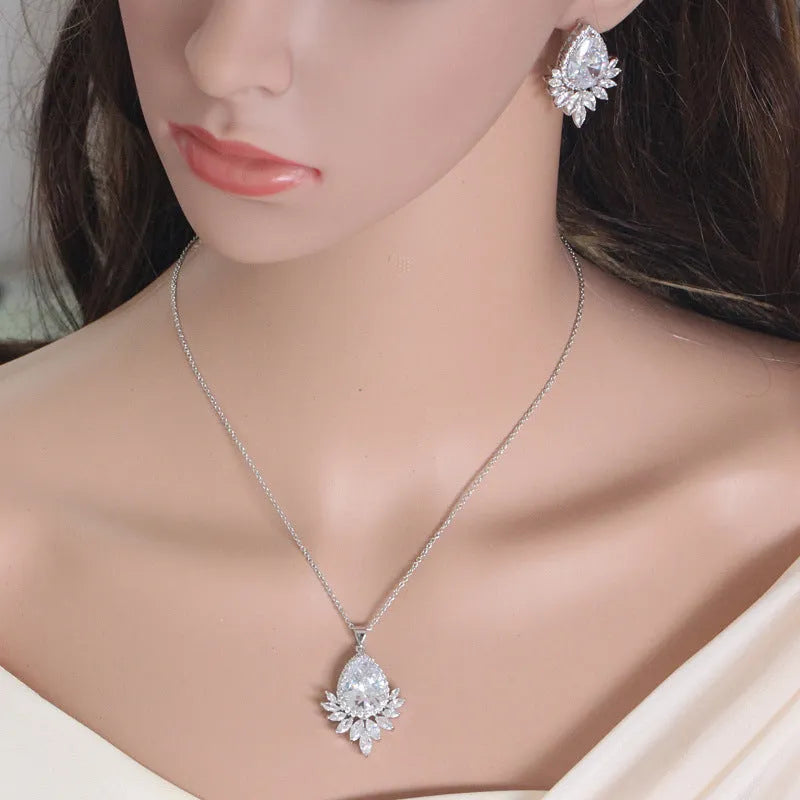 A formal jewellery chain set with necklace and earrings for bridal banquets and dinner events in blue, red, or white.