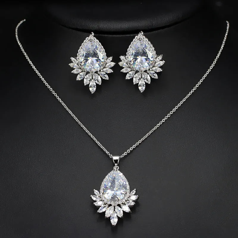 A formal jewellery chain set with necklace and earrings for bridal banquets and dinner events in blue, red, or white.
