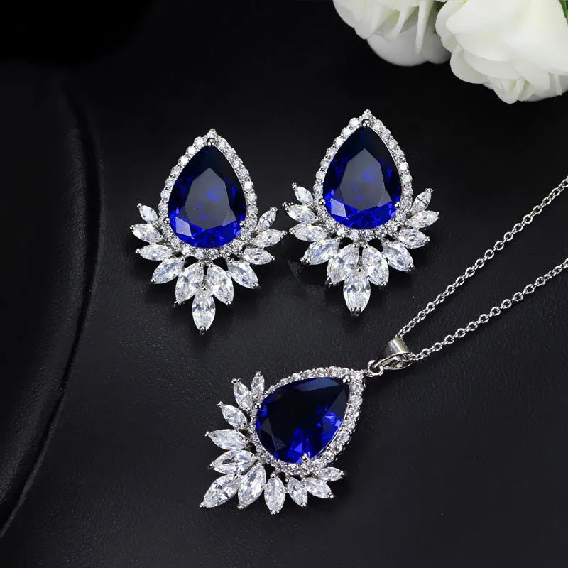 A formal jewellery chain set with necklace and earrings for bridal banquets and dinner events in blue, red, or white.