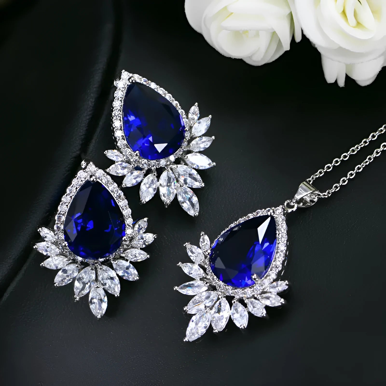 A formal jewellery chain set with necklace and earrings for bridal banquets and dinner events in blue, red, or white.