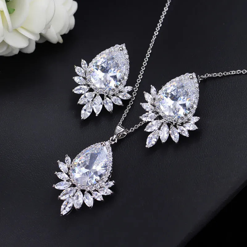A formal jewellery chain set with necklace and earrings for bridal banquets and dinner events in blue, red, or white.