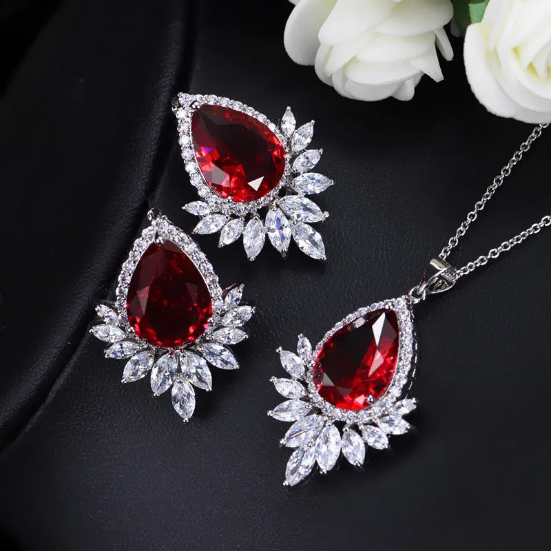 A formal jewellery chain set with necklace and earrings for bridal banquets and dinner events in blue, red, or white.