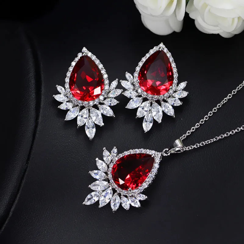 A formal jewellery chain set with necklace and earrings for bridal banquets and dinner events in blue, red, or white.