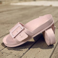 Women's grey blue EVA buckle slippers on a light background, showing the adjustable strap and textured sole.