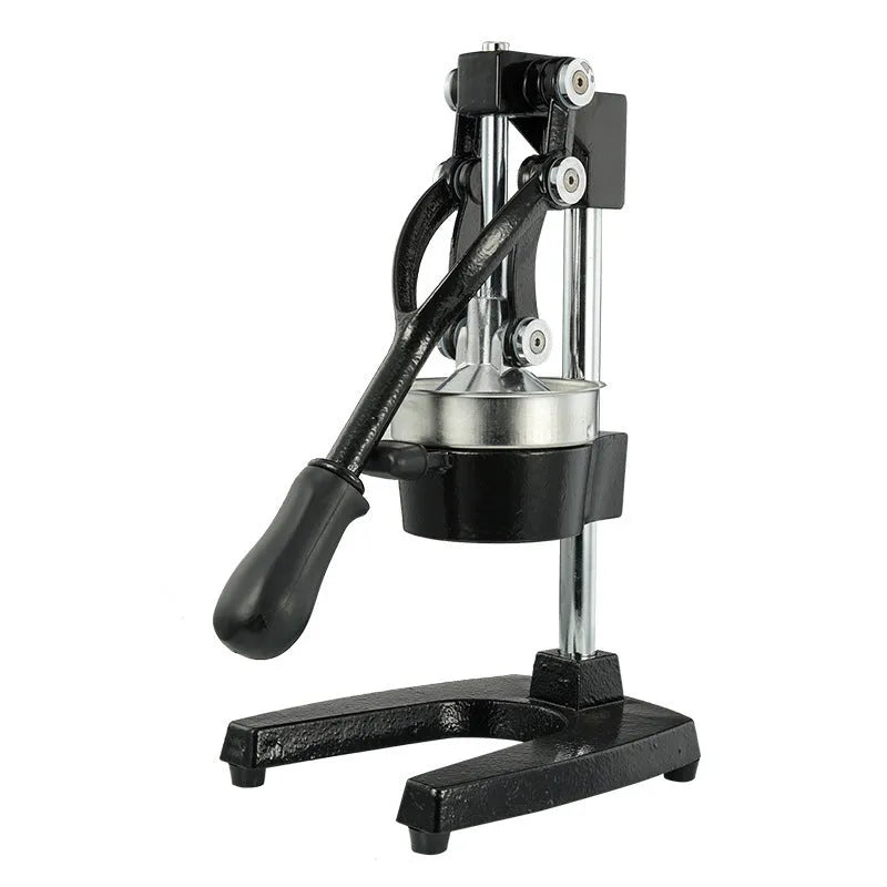 Black or white manual cast iron citrus juicer with stainless steel funnel on a kitchen counter.