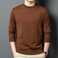 Men's round neck grey wool blend pullover sweater with long sleeves on a hanger.