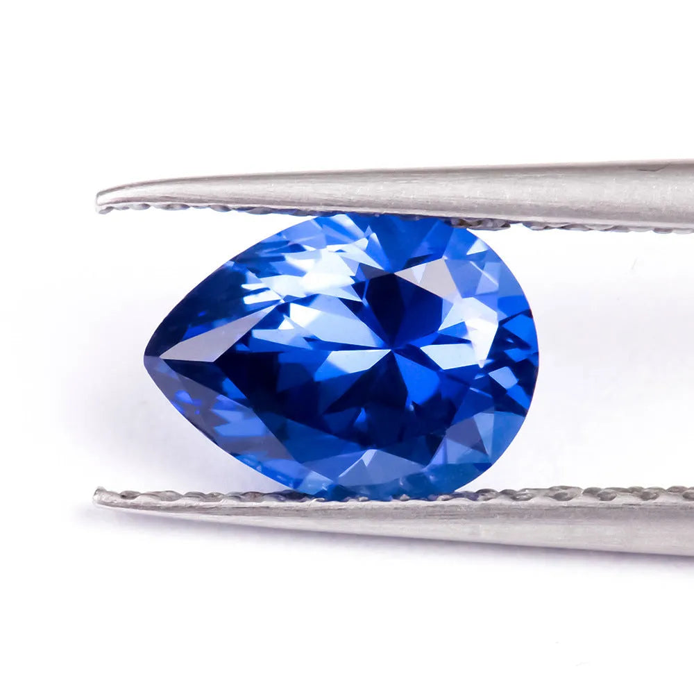 Royal blue synthetic gemstone showing heart, round, and pear cut shapes for jewellery making
