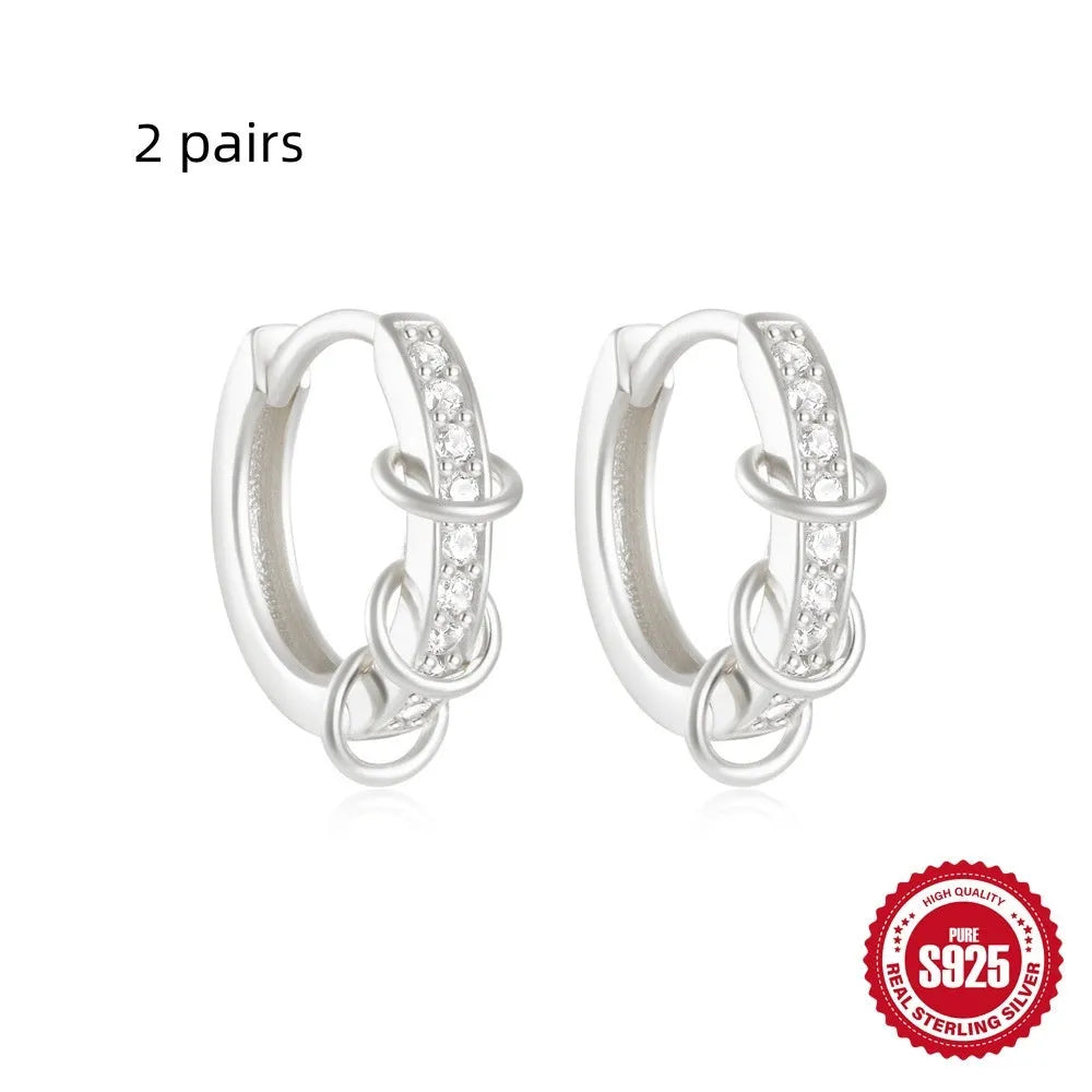 Sterling silver geometric stud earrings with small round diamond detailing in gold and silver electroplated finishes