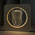 Small tooth-shaped night lamp with log color plastic finish measuring 190x190x30mm