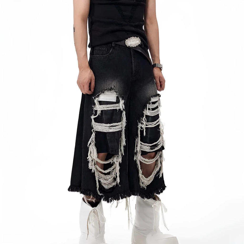 Black women's cropped wide leg jeans with a distressed patch detail on the leg.