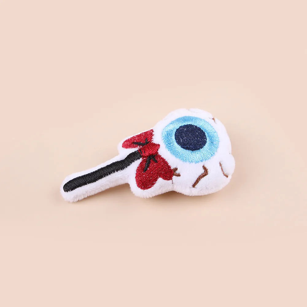 Colourful plush cat teaser wand with candy, eyes and skull animal shapes for interactive play