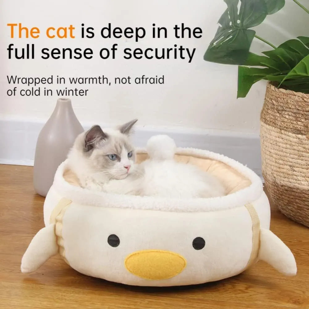 Green dinosaur-shaped cat bed with hanging straps that can be used flat or as a hammock