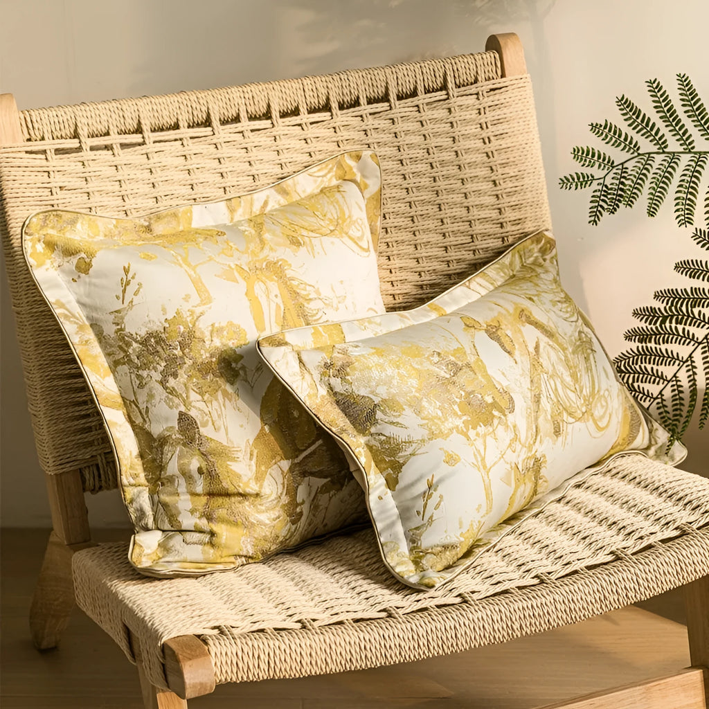 Close-up of a modern abstract golden horse design on a textured jacquard cushion in golden yellow.