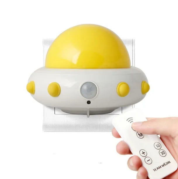 Remote control UFO shaped bedside night light in blue, pink, or white colour.